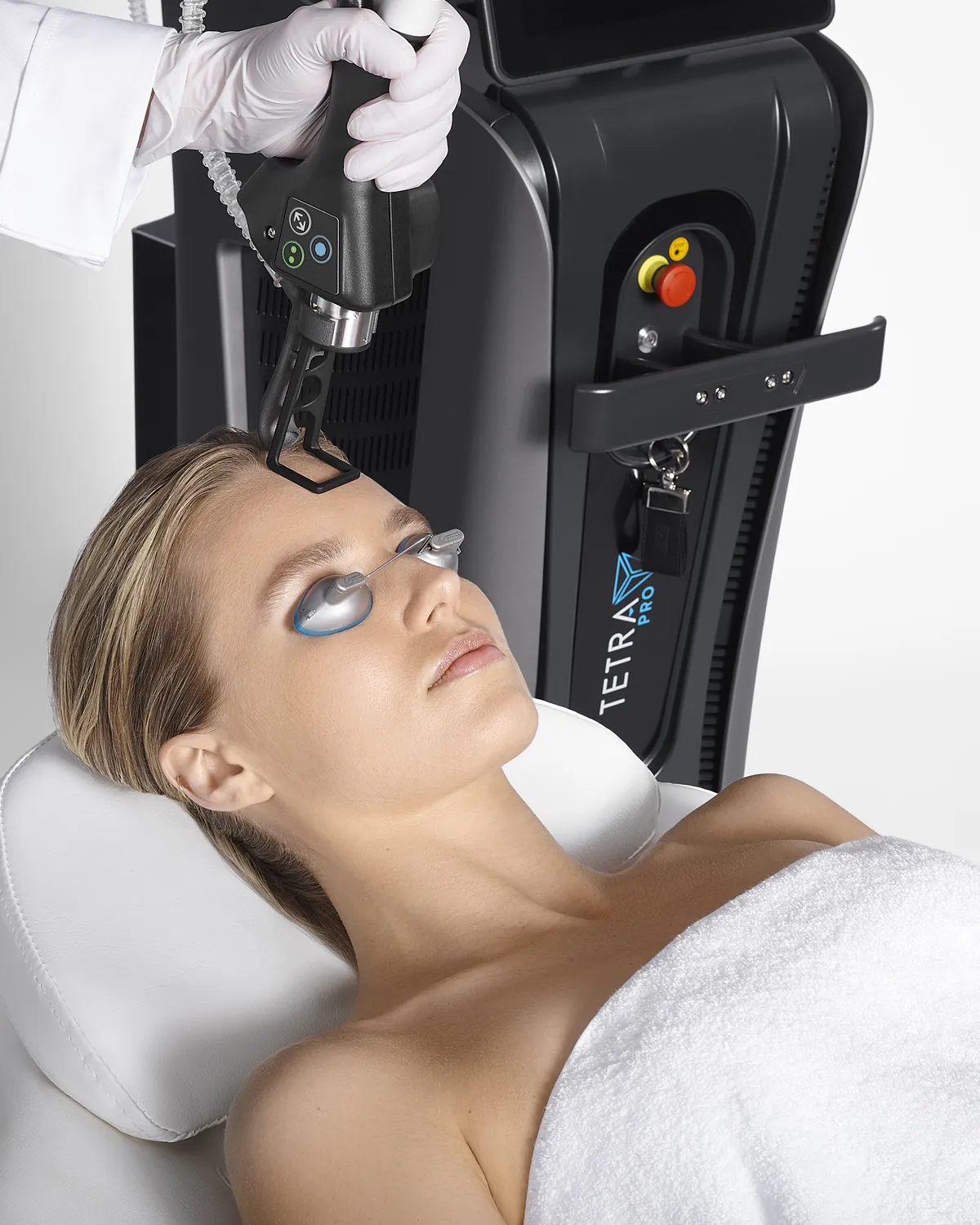 A client receiving a CoolPeel CO₂ laser treatment with the Tetra Pro system